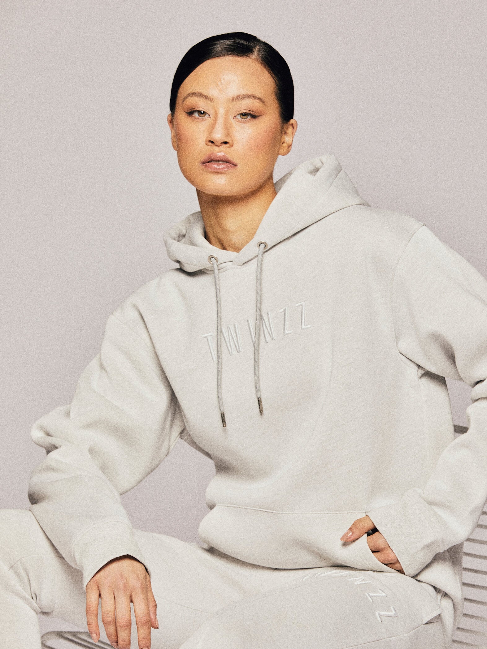 Twinzz grey hoodie on female model