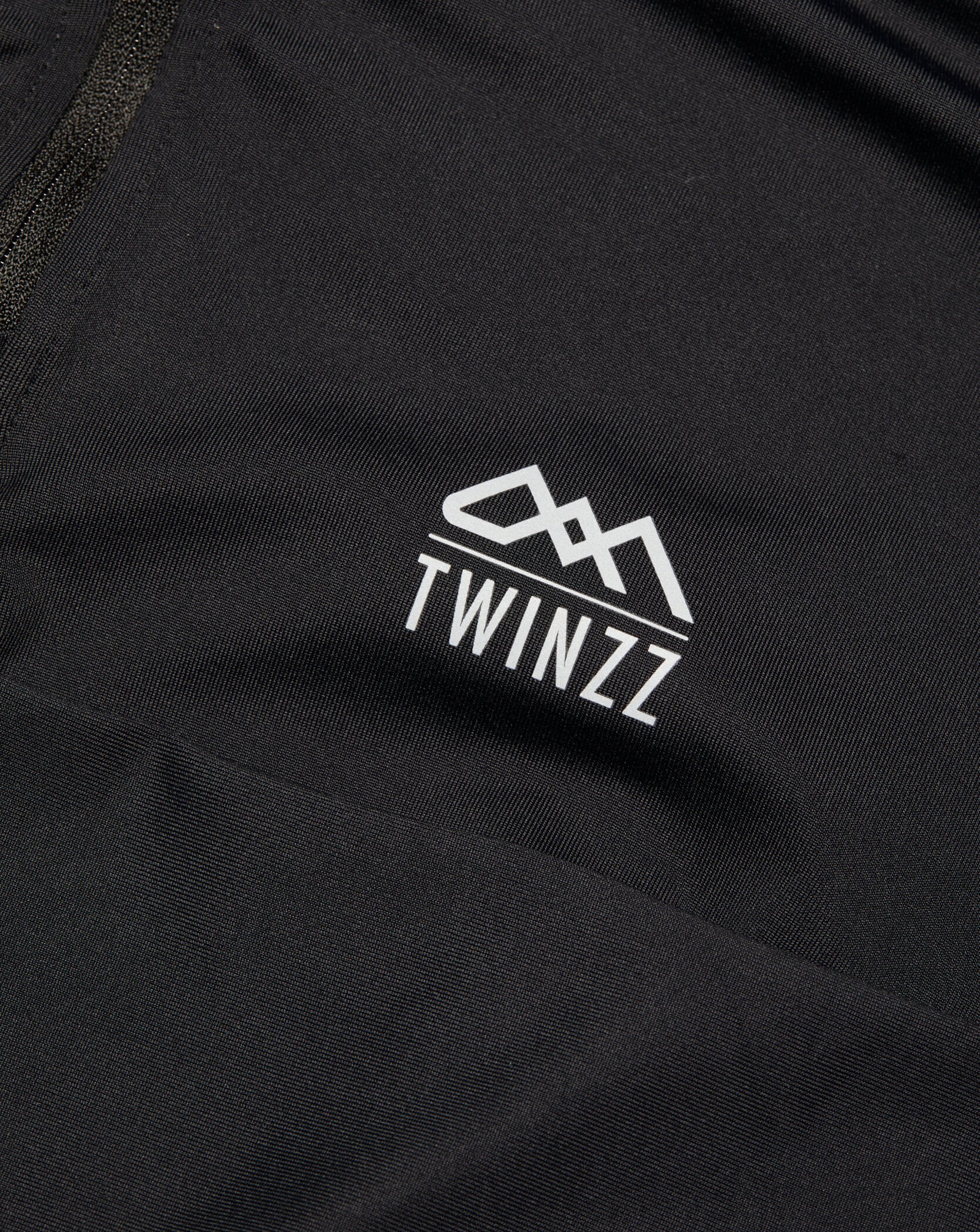 Black Twinzz activewear zip top logo