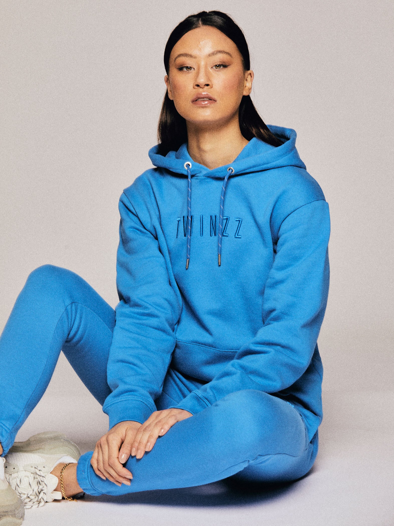 Twinzz blue hoodie and joggers on female model