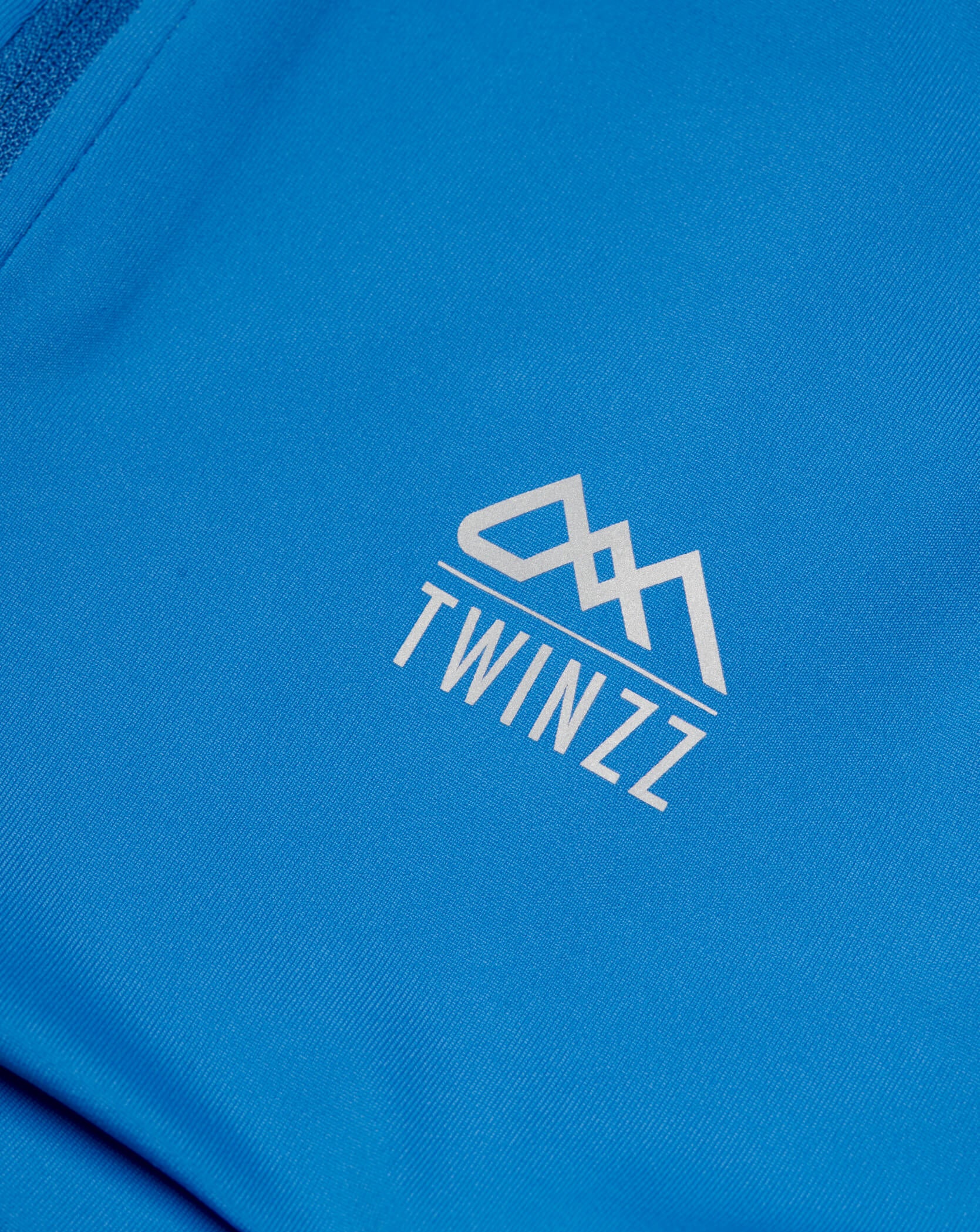 Blue Twinzz activewear zip top logo