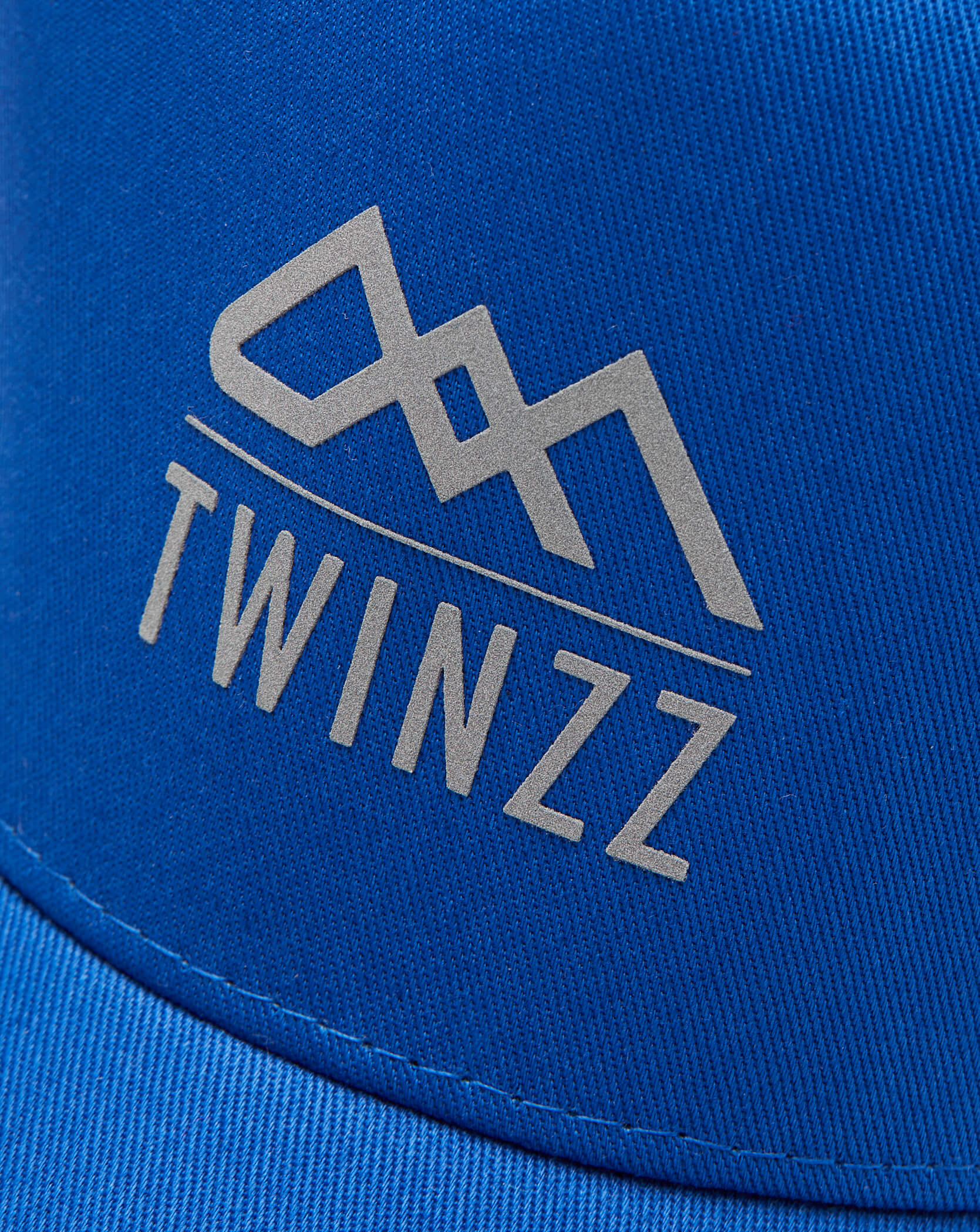 Twinzz blue trucker hat with silver logo